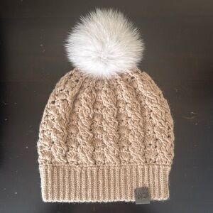 Handwoven beige winter toque/hat with Pom Pom.